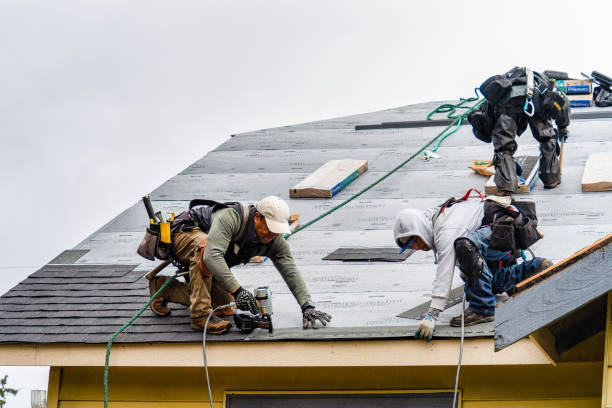 Professional Roofing technician working in Island Park, NY